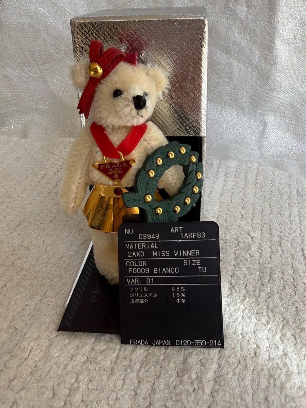 Prada Bianco Teddy Bear Ornament with Red Ribbon and Gold Accents